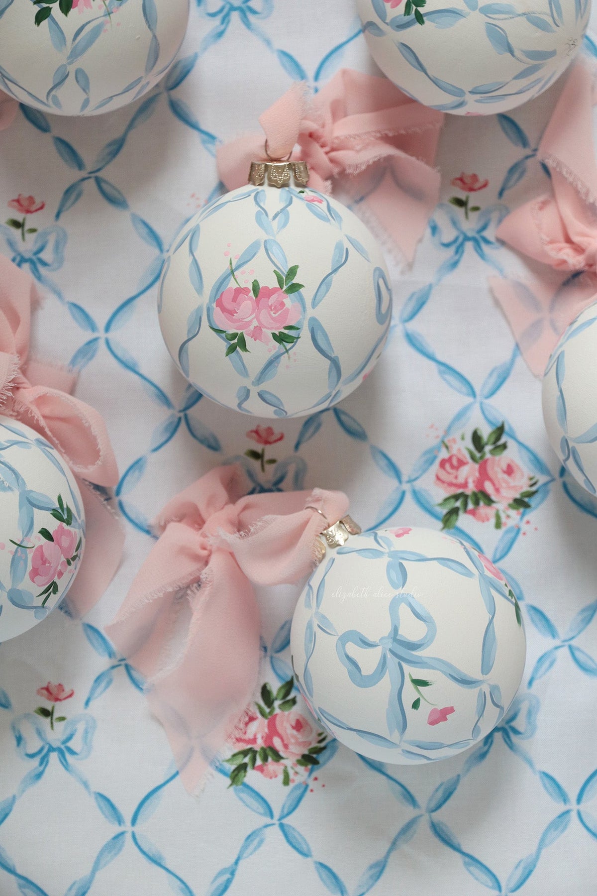 Ribbon trellis and rose hand-painted ornament