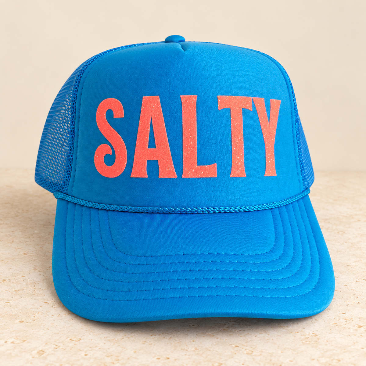 SALTY neon blue trucker — studio product photo