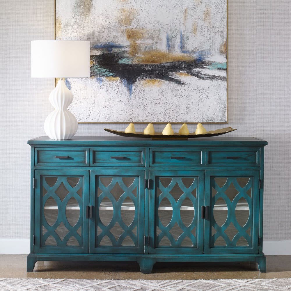 Green credenza styled beneath artwork