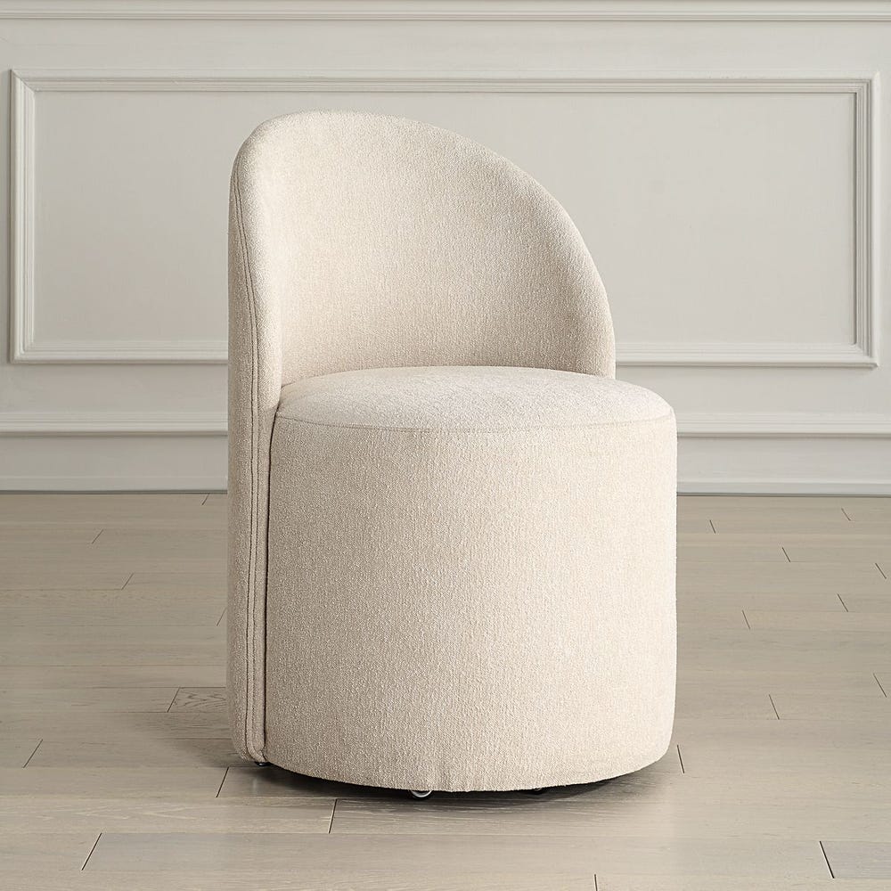 The Emery Upholstered Rolling Dining Chair
