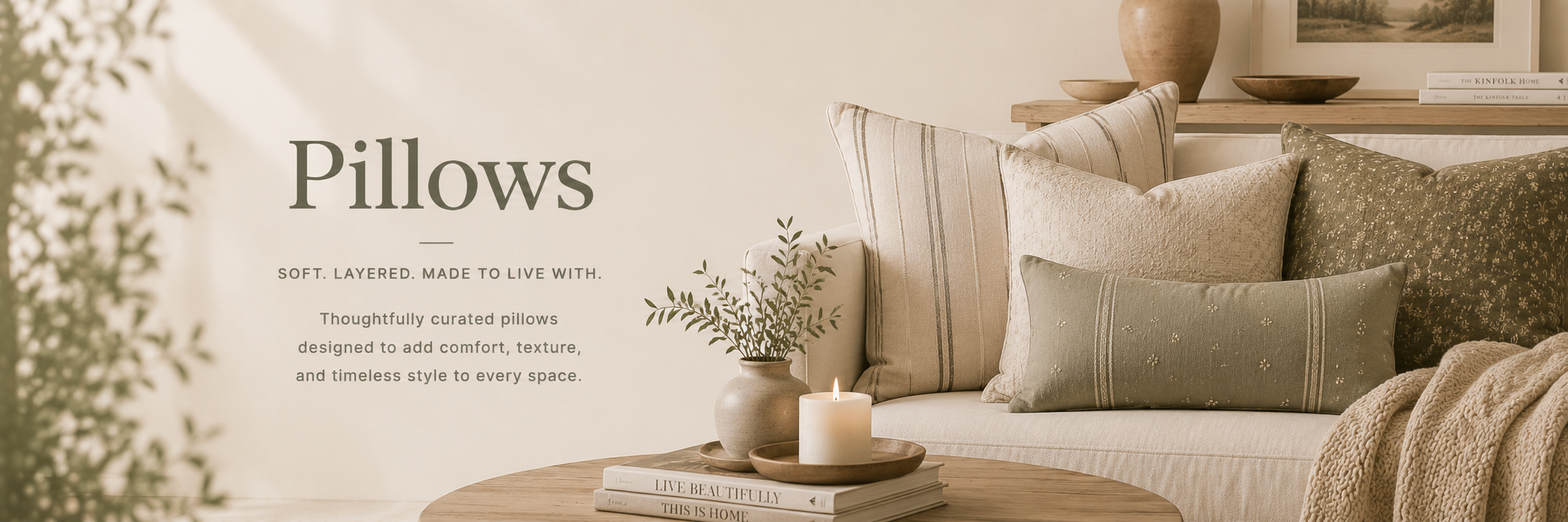A beautifully styled living room featuring layered decorative pillows in soft textures, neutral tones, and timeless patterns.