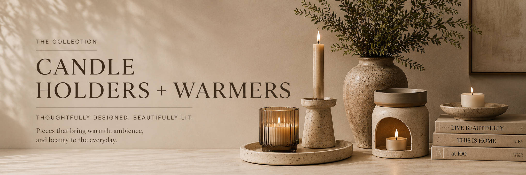 xNeutral-toned candle holders and a candle warmer styled with soft lighting and natural textures in a warm interior