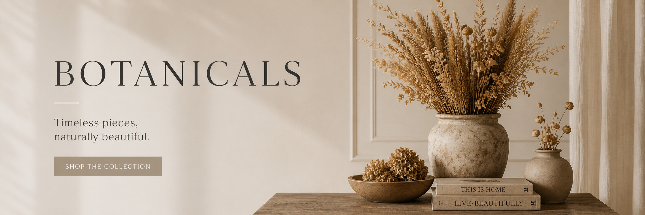muted colors in a warm setting with dried wheat in a vase