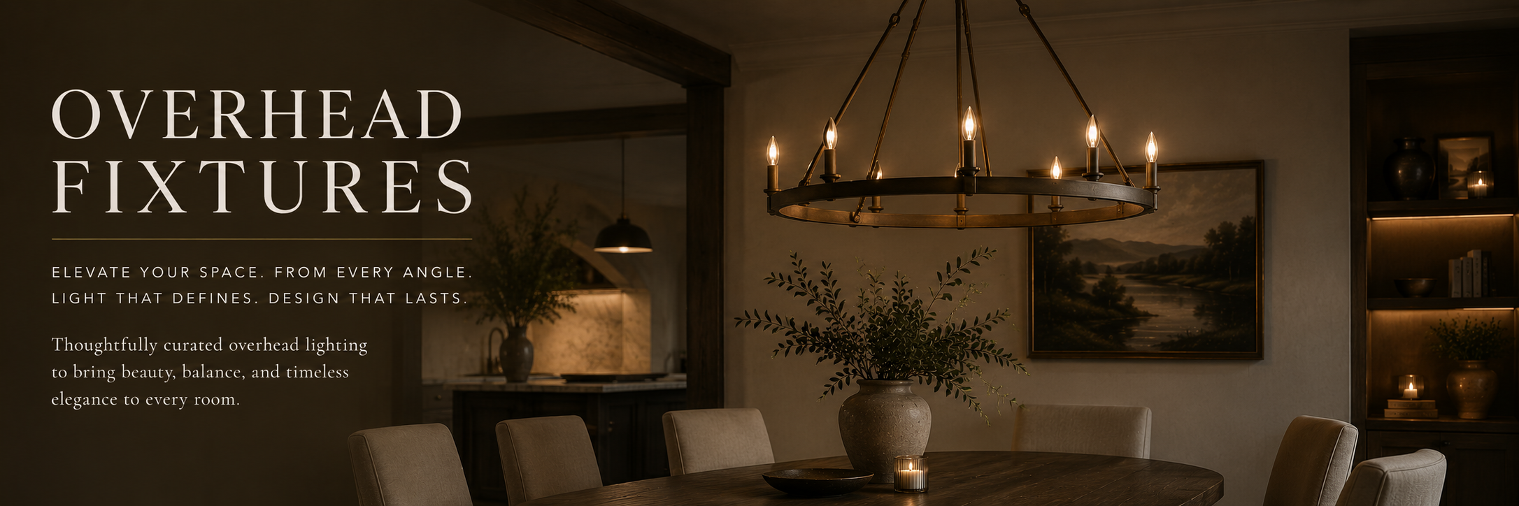 Moody interior with a warm glowing chandelier overhead, styled with neutral decor and natural textures