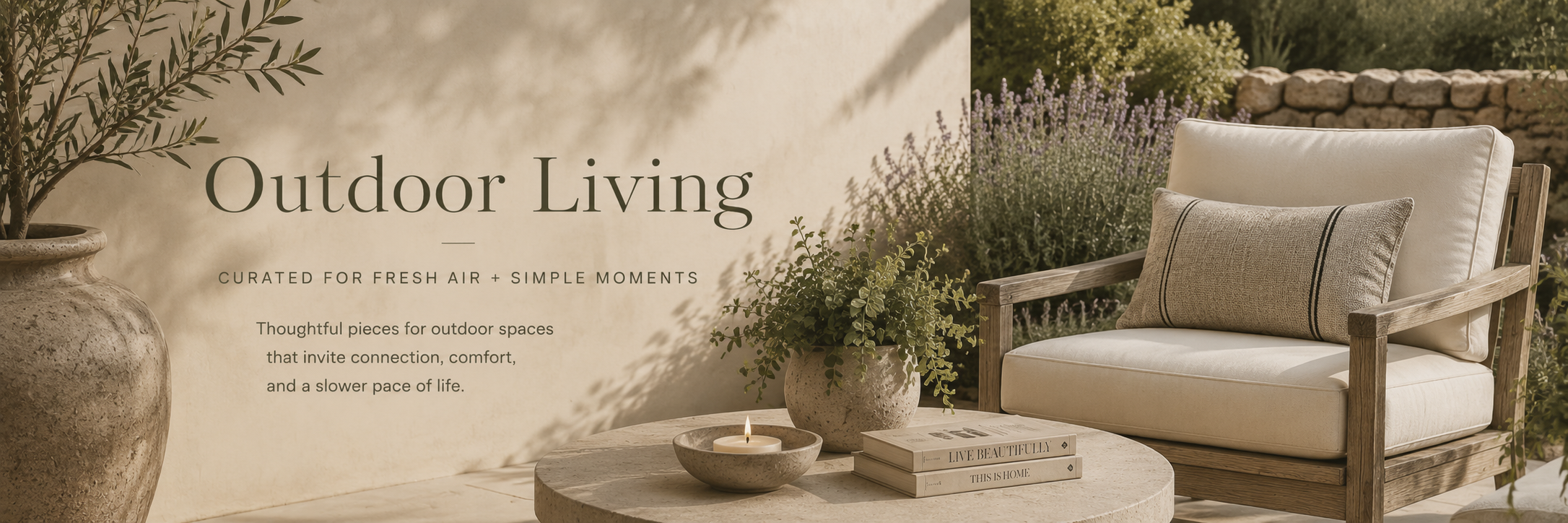 Warm neutral outdoor patio with refined lounge seating, natural textures, and soft greenery