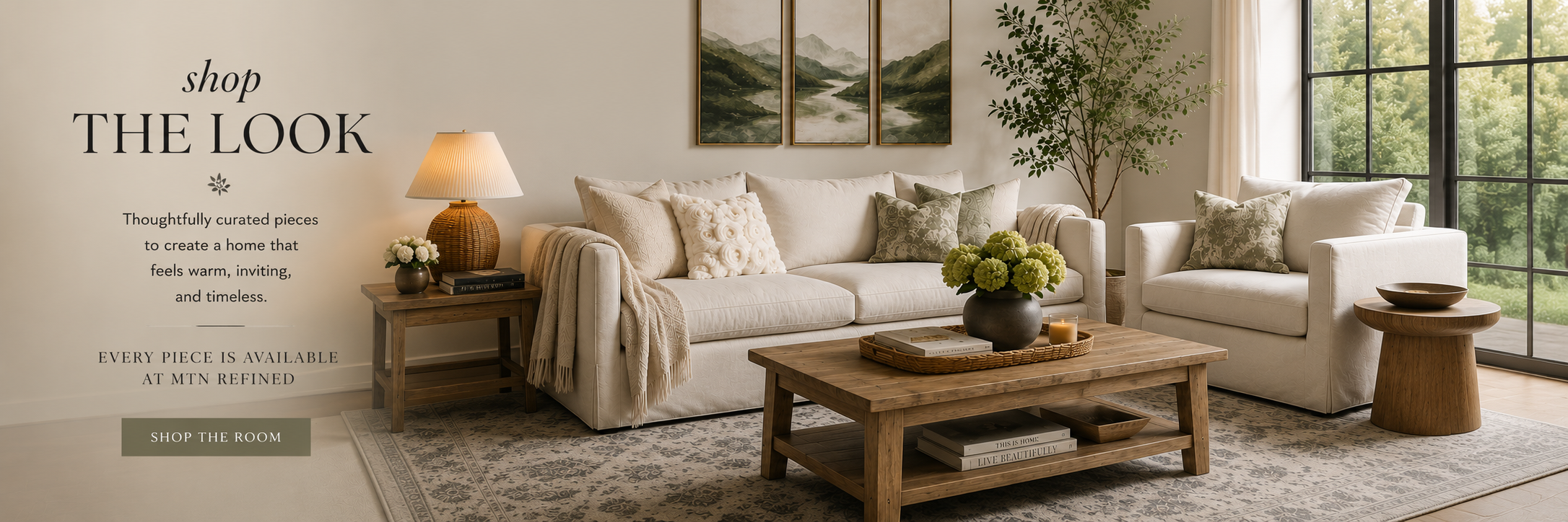 Shop the Look living room featuring the Maggie Sofa, Maggie Chair and a Half, Timbergirl Coffee Table, Still River wool rug, Wylla Rattan Lamp, and Sylvie Mountain artwork.