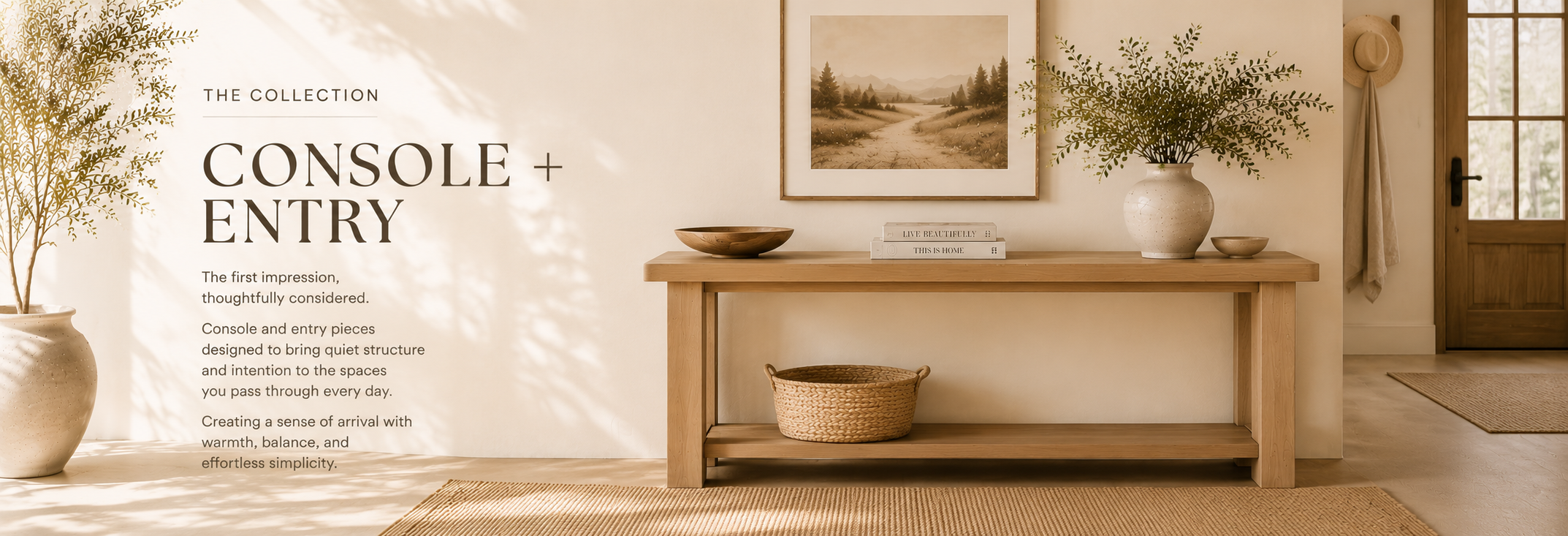 Neutral entryway with a wood console table, styled with decor, soft lighting, and natural textures