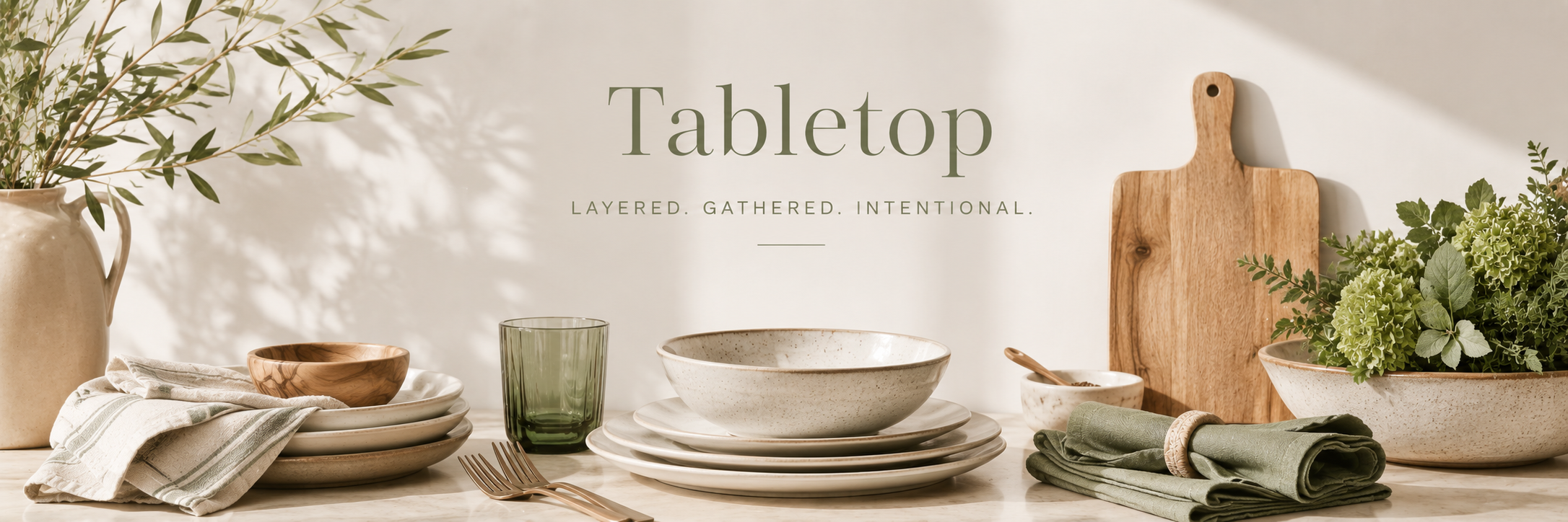 Neutral tabletop decor with layered plates, bowls, and linens styled in a warm, refined dining setting