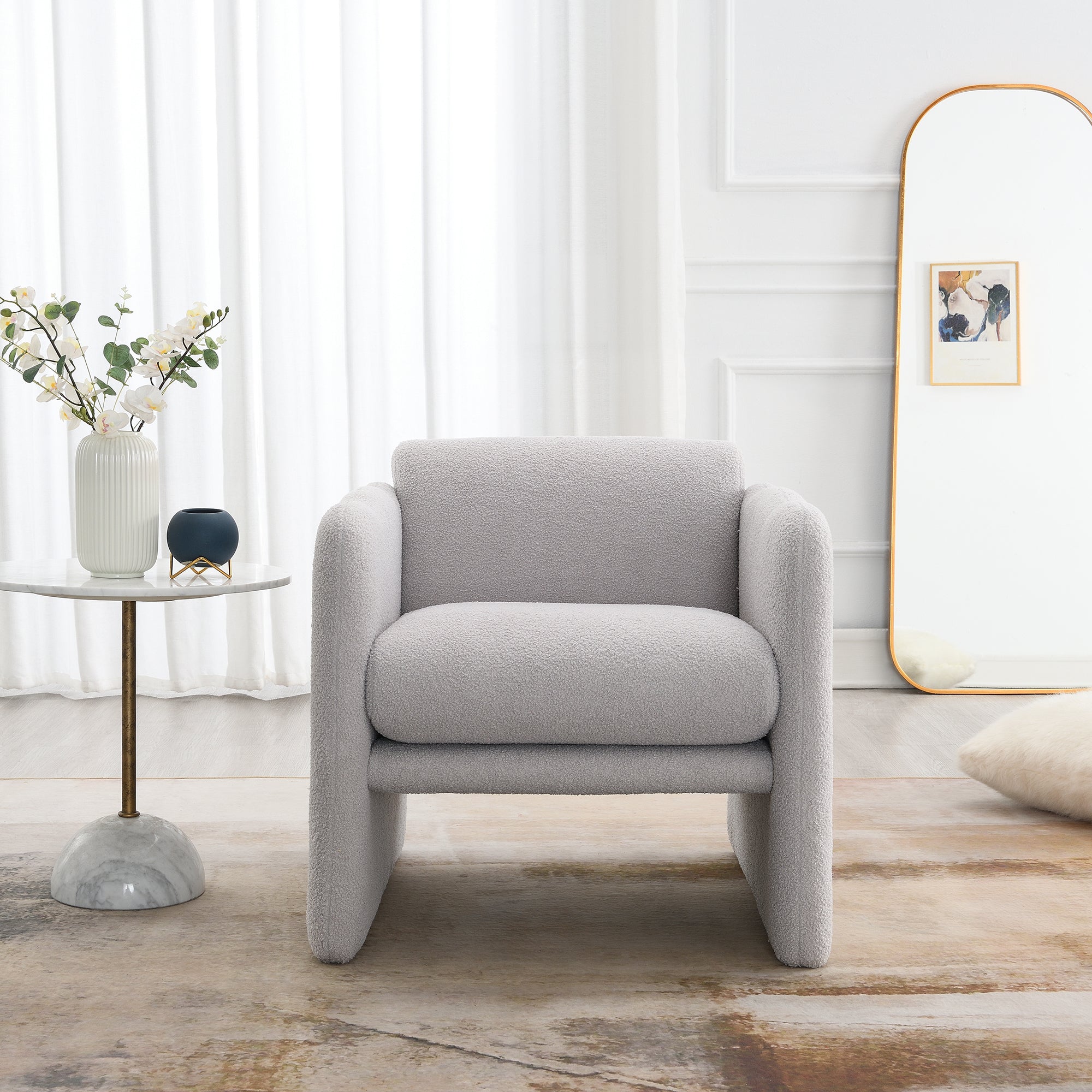 Armchair with wavy armrests, metal decorations on both sides of the armrests, made of Teddy cloth, light gray