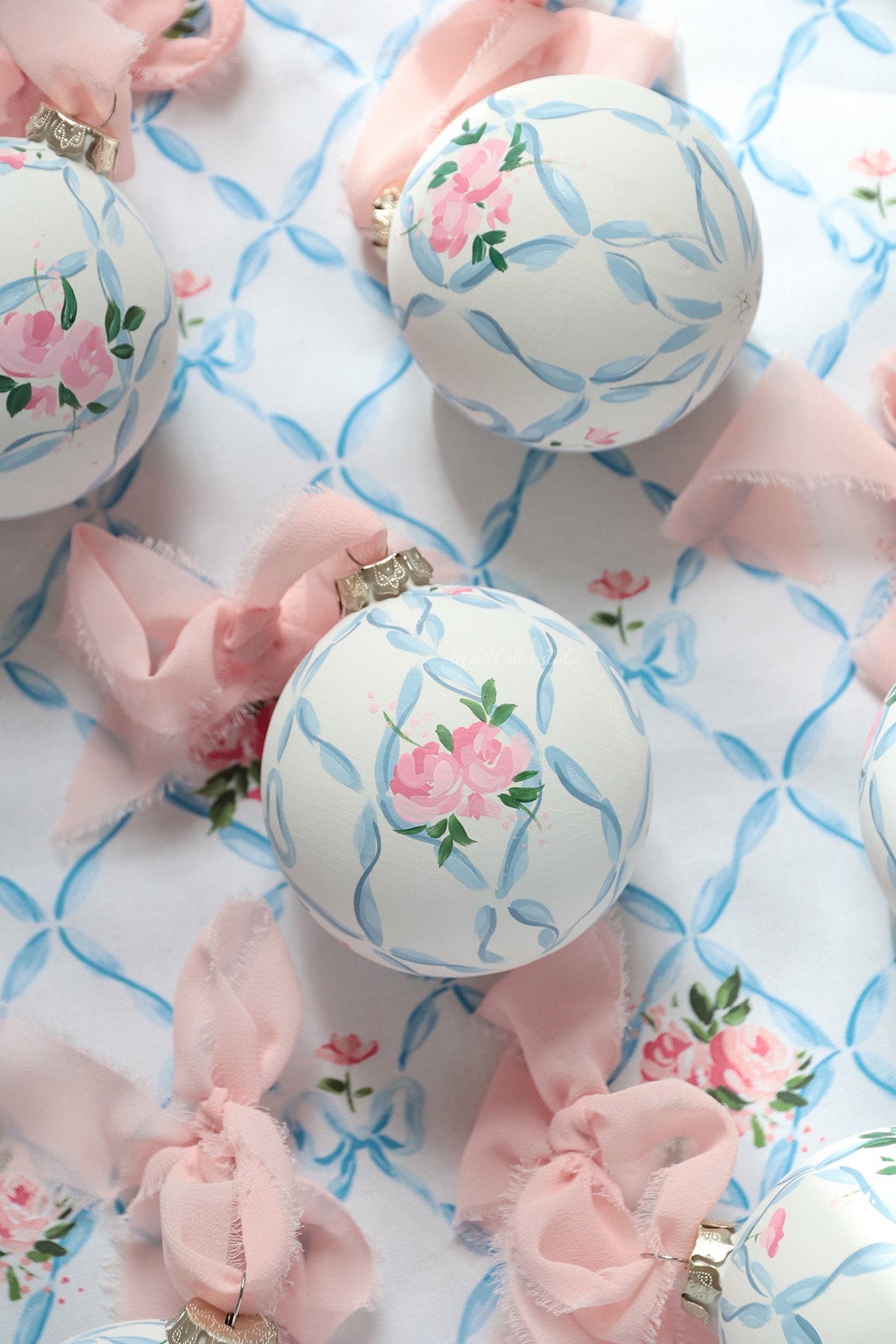 Ribbon trellis and rose hand-painted ornament