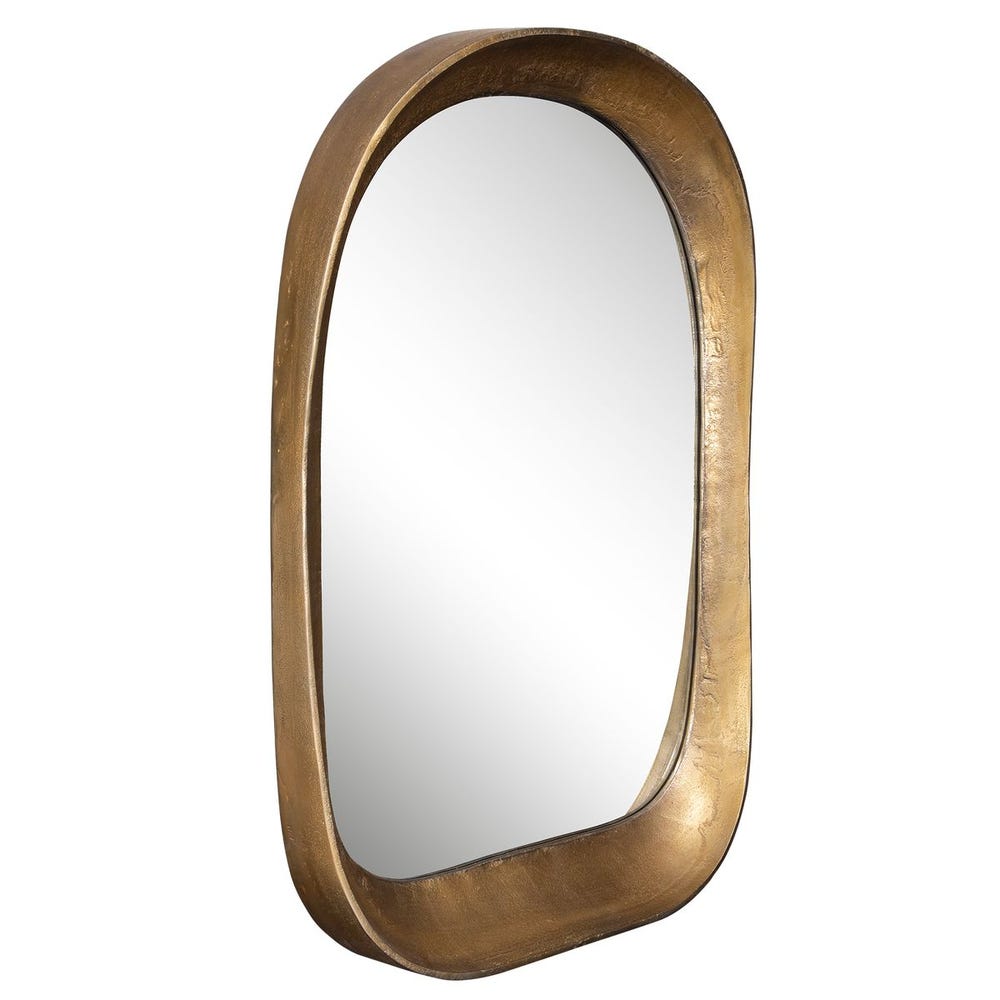 Angled view of brass arched mirror