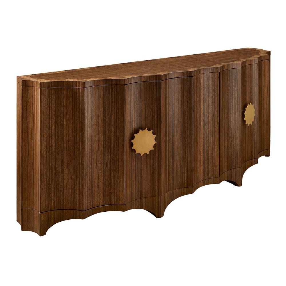 Angled view of curved wood cabinet with fluted doors and brass pulls