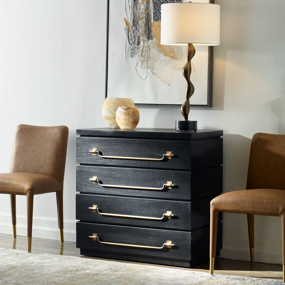 Black chest styled with a lamp and chairs