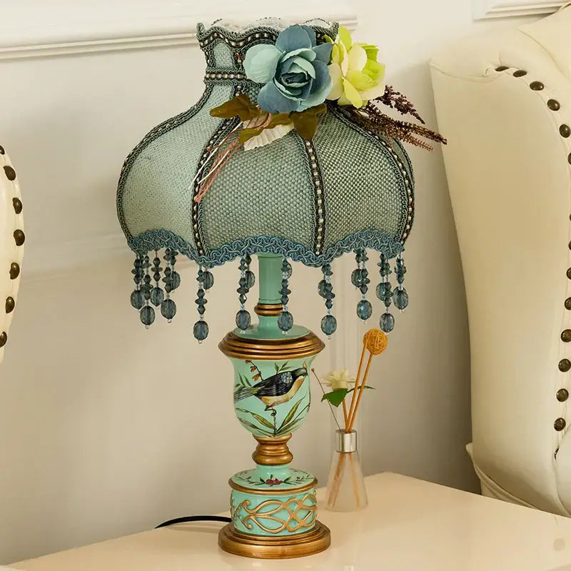 Retro mint green resin table lamp with butterfly detail bedroom light