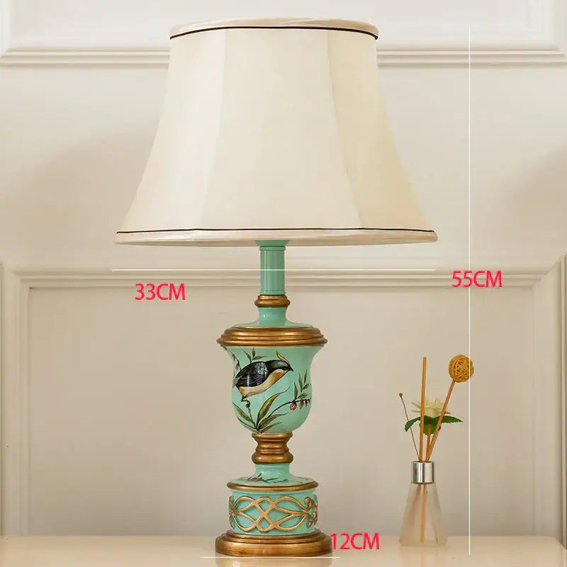 Retro mint green resin table lamp with butterfly detail bedroom light