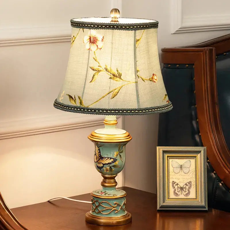 Retro mint green resin table lamp with butterfly detail bedroom light