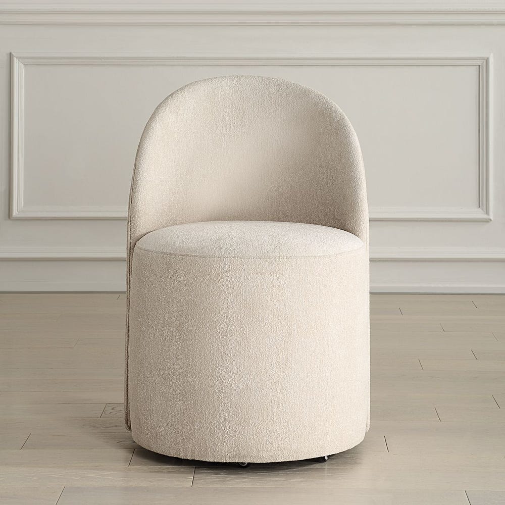 The Emery Upholstered Rolling Dining Chair