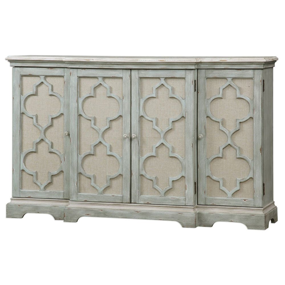 Angled view of carved four-door cabinet